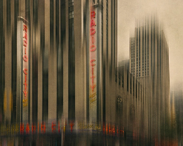 Framed artwork of Radio City Music Hall with a blurred cityscape background. 'Bad Transmission' by Andrew Para Photographic Artslider_item_dgkVrC
