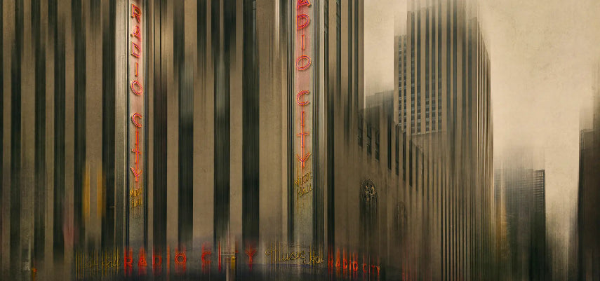 Framed artwork of Radio City Music Hall with a blurred cityscape background. 'Bad Transmission' by Andrew Para Photographic Artslider_item_dgkVrC